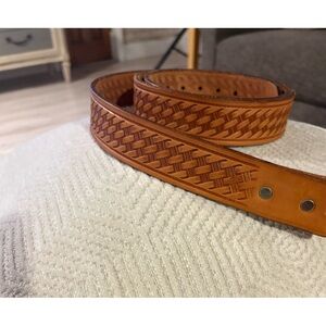 LOOPER 52” light brown leather belt in a Basketweave Pattern. Like new.